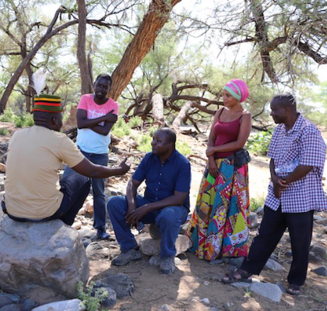 From left: Abdi Achegei Adan, the Director of Elemi Development Organization, John Namai (a storyteller) Calistus Wachana (ICPAC User Engagement Expert), Mara Menzies (a storyteller) and Francis Muinda (Turkana County Meteorological Services Director) during an interview at the Lokiriama Peace Accord Commemoration in Lokiriama village, Turkana County, Kenya